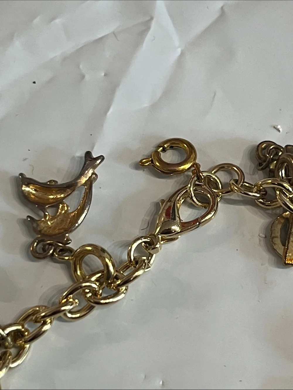 DIAMOND INTERNATIONAL GOLDTONE CHARM BRACELET